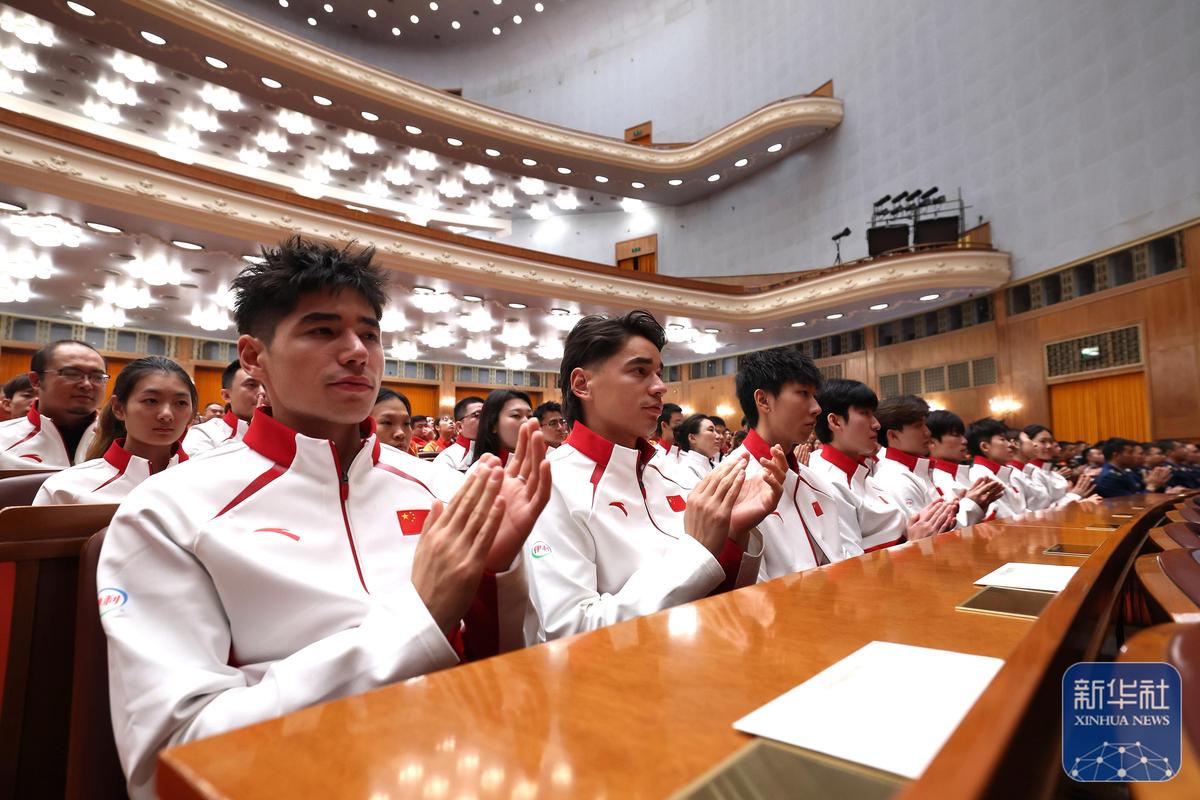 第三十三届奥运会中国体育代表团报告会在京举行